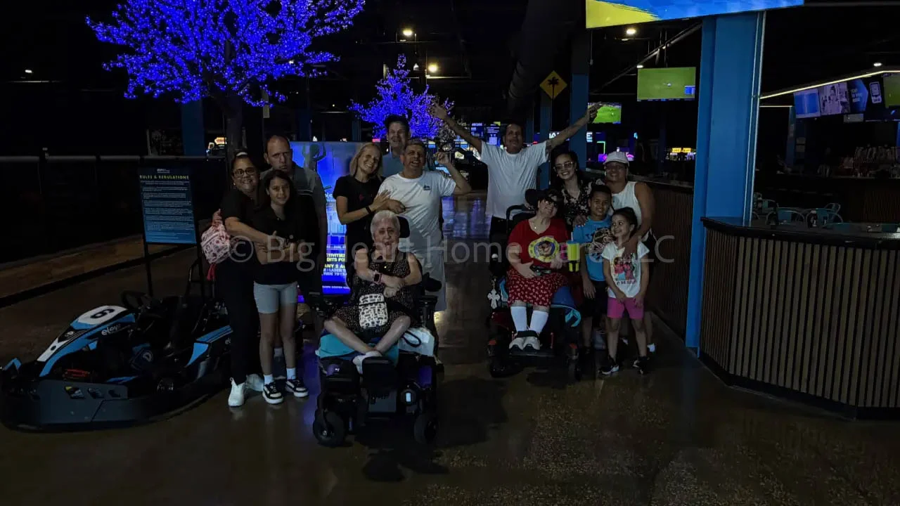 Big Heart Group Home residents, staff, and family members gathered together during a community outing at ELEV8 Fun Tampa in Tampa, Florida.